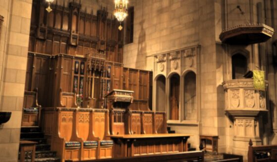 An altar sits in a bright Presbyterian Church hall.