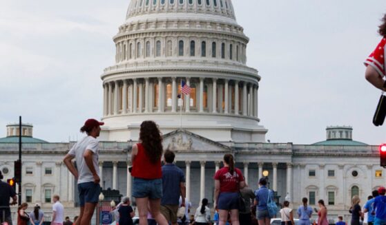The United States Capitol Building stands as celebrators of America 250 gather in the National Mall on July 4, 2026.