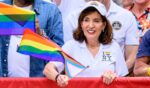 New York Gov. Kathy Hochul waves a transgender flag during the 2026 "Pride March" on June 28 in New York City.