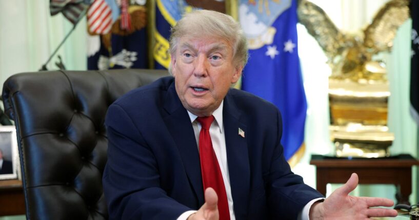 President Donald Trump sits at the desk in the Oval Office of the White House as he speaks to reporters on June 29, 2026 in Washington.