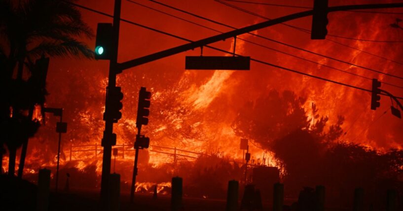 Flames engulf the intersection of Temescal Canyon and the Pacific Coast Highway as the Palisades Fire devastates a Los Angeles suburb on Jan. 7, 2025.