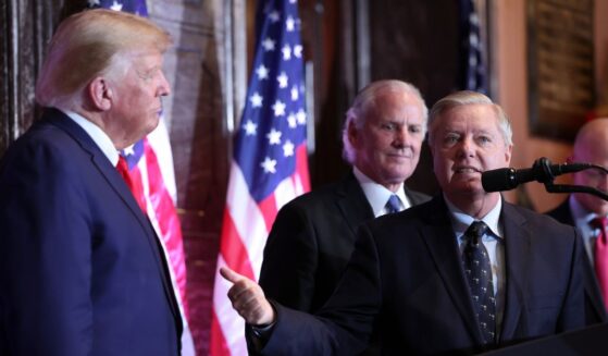 U.S. Sen. Lindsay Graham (R-SC) ushers towards President Donald Trump at an event at the South Carolina State House on Jan. 8, 2023 in Columbia, South Carolina.