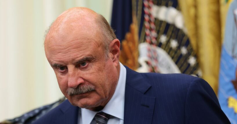 Dr. Phil McGraw looks on at an event in the Oval Office of the White House in Washington, DC on June 26, 2026.
