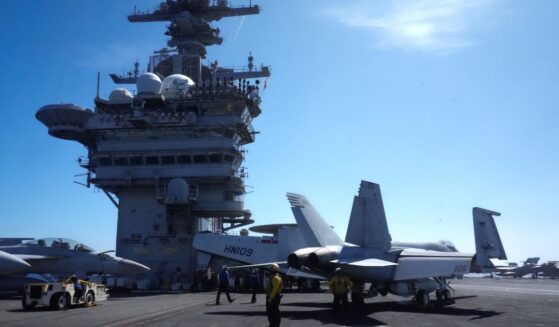 U.S. Navy aircraft sit on the flight deck of the USS Theodore Roosevelt aircraft carrier in Honolulu, Hawaii, on July 17, 2026.