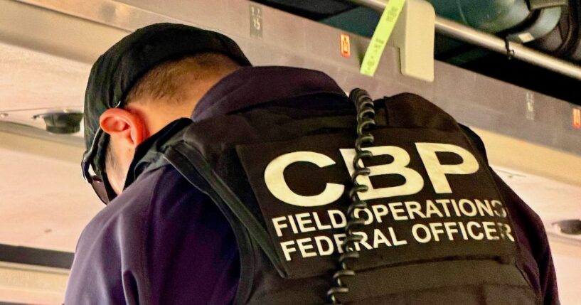 A U.S. Customs and Border Patrol agent vets passengers at the border between Canada and the U.S.