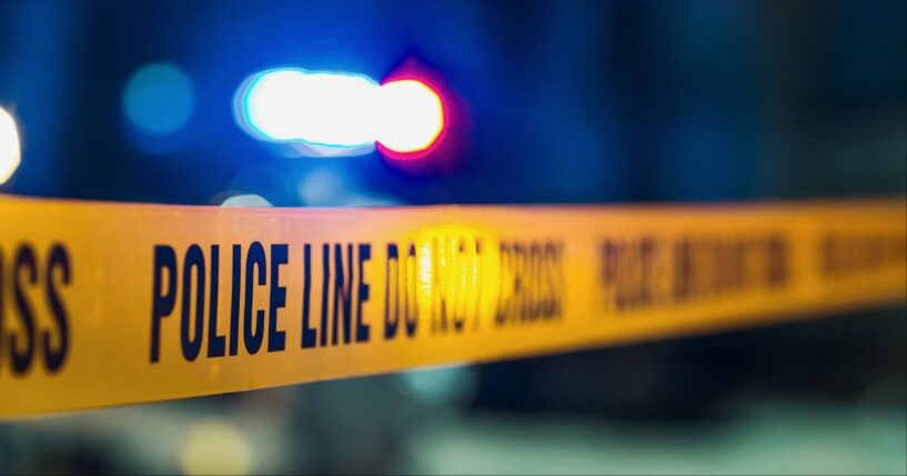 A close-up shot of police tape at a crime scene.