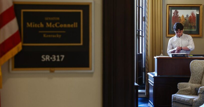 A staff member checks his watch inside of Mitch McConnell's office July 8 in Washington, D.C. McConnell's health has become the subject of speculation.