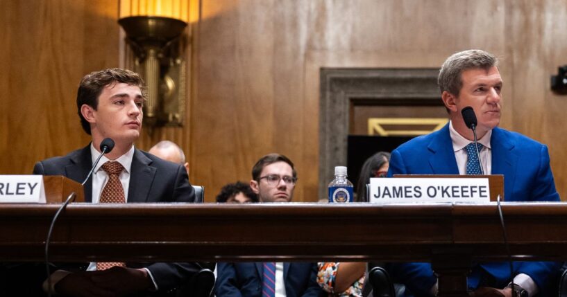 Conservative YouTuber and influencer Nick Shirley, left, and CEO of O’Keefe Media Group James O'Keefe listen Wednesday during a Senate Homeland Security and Governmental Affairs Committee hearing on exposing fraud in Washington, D.C.