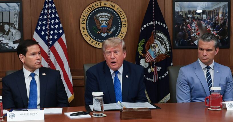 President Donald Trump speaks during a Cabinet meeting Friday at Camp David, the presidential retreat, flanked by Secretary of State Marco Rubio, left, and Secretary of Defense Pete Hegseth, right.