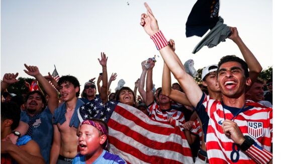 Fans cheer on the United States Wednesday as they face Bosnia and Herzegovina in a knockout round at the FIFA Fan Zone on the National Mall in Washington, D.C.