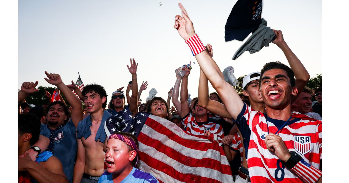 Fans cheer on the United States Wednesday as they face Bosnia and Herzegovina in a knockout round at the FIFA Fan Zone on the National Mall in Washington, D.C.