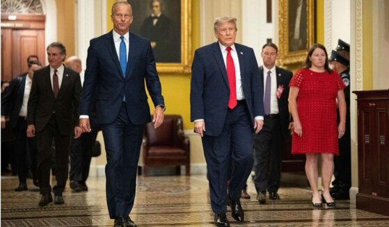President Donald Trump walks with Senate Majority Leader John Thune of South Dakota on the way to a June 24 lunch meeting with Senate Republicans at the U.S. Capitol in Washington, D.C.