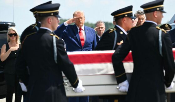 President Donald Trump salutes Wednesday as a U.S. Army team carries the flag-draped transfer case containing the remains of 1st Lt. Tyler James Feehan, 25, of Ewa Beach, Hawaii, during a dignified transfer event at Dover Air Force Base in Dover, Delaware, for U.S. service members killed during operations in the Middle East. Feehan was killed in action Saturday during an enemy attack at Muwaffaq Salti Air Base in Jordan.