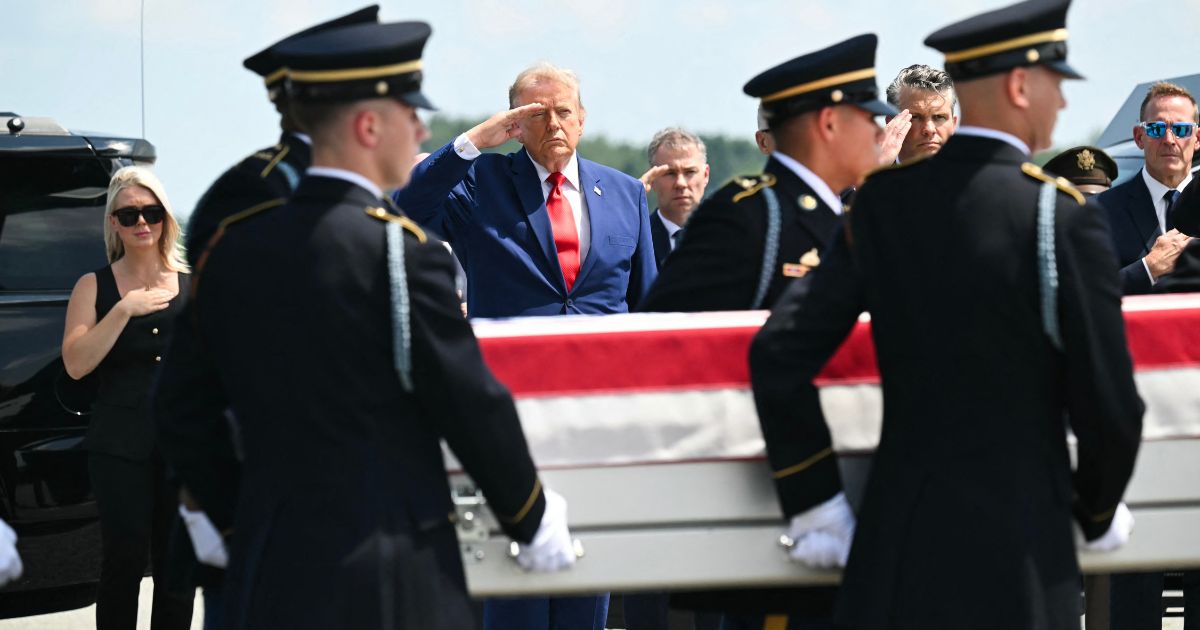 President Donald Trump salutes Wednesday as a U.S. Army team carries the flag-draped transfer case containing the remains of 1st Lt. Tyler James Feehan, 25, of Ewa Beach, Hawaii, during a dignified transfer event at Dover Air Force Base in Dover, Delaware, for U.S. service members killed during operations in the Middle East. Feehan was killed in action Saturday during an enemy attack at Muwaffaq Salti Air Base in Jordan.