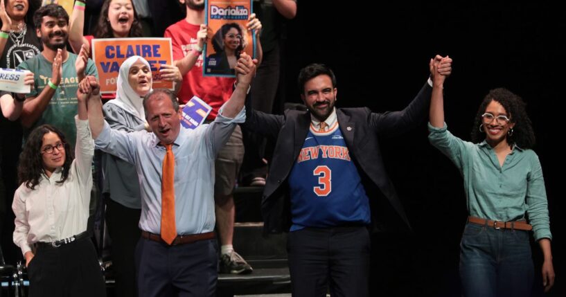 Congressional candidate Claire Valdez, Congressional candidate Brad Lander, Mayor Zohran Mamdani, and Congressional candidate Darializa Avila Chevalier raise their hands during a Get Out the Vote rally at King's Theater on June 18, 2026, in New York City.