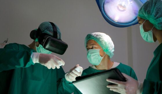 Doctors in surgery in an operating room.