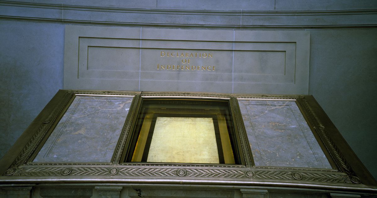 The Declaration of Independence, displayed in a dimly lit hall at the National Archives, reserved for the original Charters of Freedom in Washington, D.C.