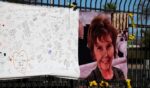 A photograph of Nancy Guthrie is seen on a sign that people can leave messages on Feb. 26, 2026, in Tucson, Arizona.