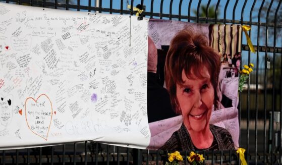 A photograph of Nancy Guthrie is seen on a sign that people can leave messages on Feb. 26, 2026, in Tucson, Arizona.