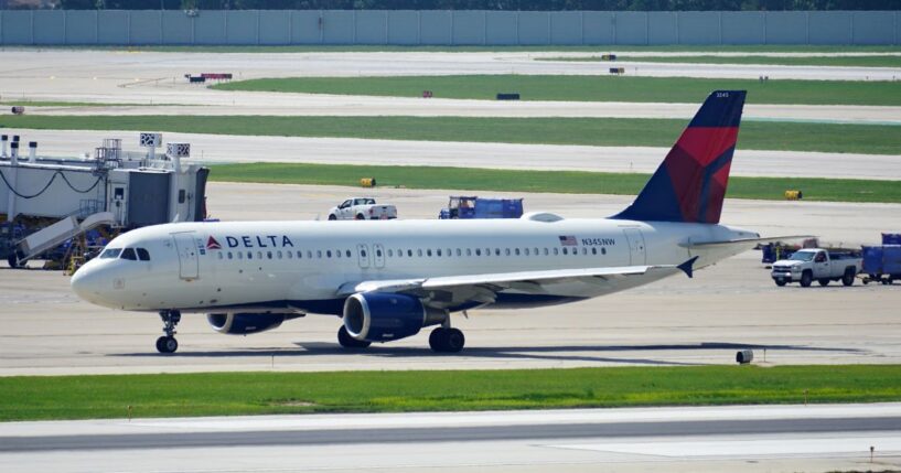 A Delta Air Lines plane taxies on the runway after landing at Chicago Midway International Airport on Aug. 2, 2023.