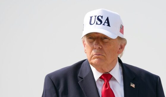 President Donald Trump walks to board Air Force One as he departs Bismarck Municipal Airport on July 1, 2026, in Bismarck, North Dakota.
