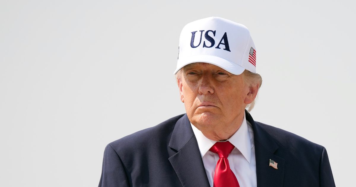 President Donald Trump walks to board Air Force One as he departs Bismarck Municipal Airport on July 1, 2026, in Bismarck, North Dakota.