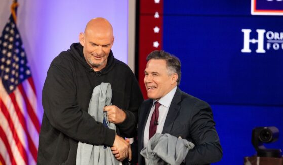 Sens. John Fetterman and David McCormick shake hands after the sixth installment of The Senate Project moderated by Fox News anchor Shannon Bream at the Edward M. Kennedy Institute for the United States Senate on June 2, 2025, in Boston, Massachusetts.