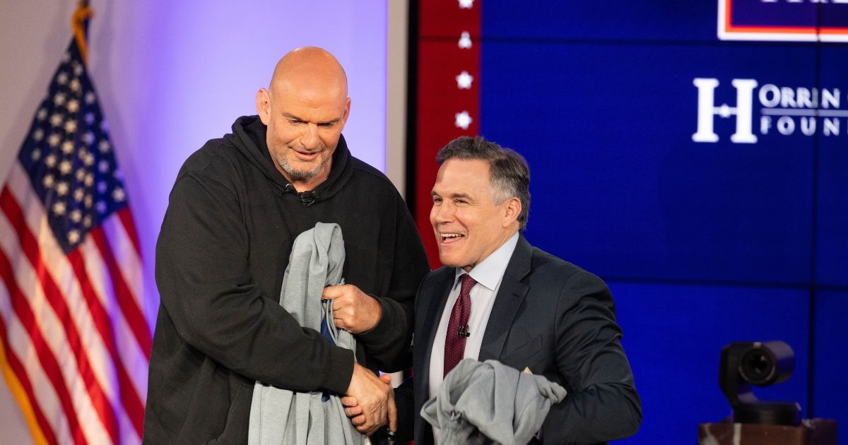 Sens. John Fetterman and David McCormick shake hands after the sixth installment of The Senate Project moderated by Fox News anchor Shannon Bream at the Edward M. Kennedy Institute for the United States Senate on June 2, 2025, in Boston, Massachusetts.