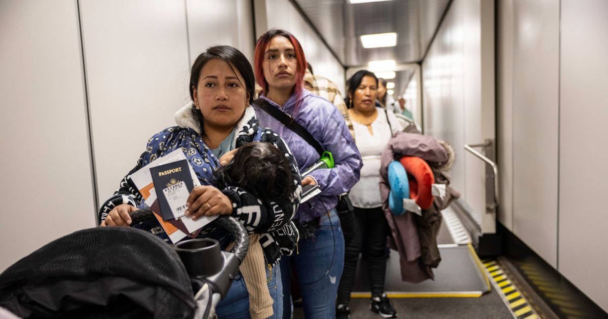 Andrea, and her cousin Jennyfer, nervously prepare to board their flight to Ecuador from JFK International Airport on Oct. 27, 2025, in New York, New York.