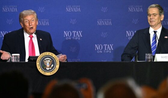 President Donald Trump speaks, flanked by Treasury Secretary Scott Bessent, during a roundtable discussion on his "no tax on tips" policy at the AC Hotel Las Vegas Symphony Park in Las Vegas, Nevada, on April 16, 2026.