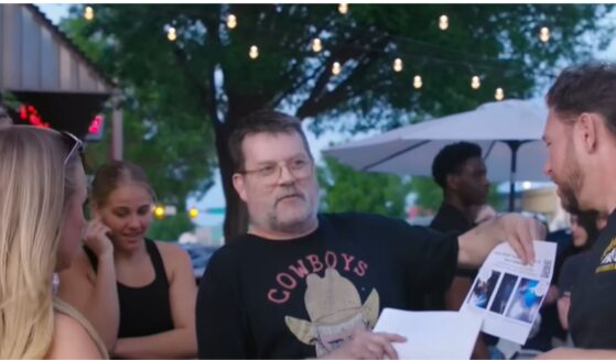 Abortion abolitionist activist T. Russell Hunter engages with a young woman and a college professor in Norman, Oklahoma, as shown in a June 5 video from Abolitionists Rising.