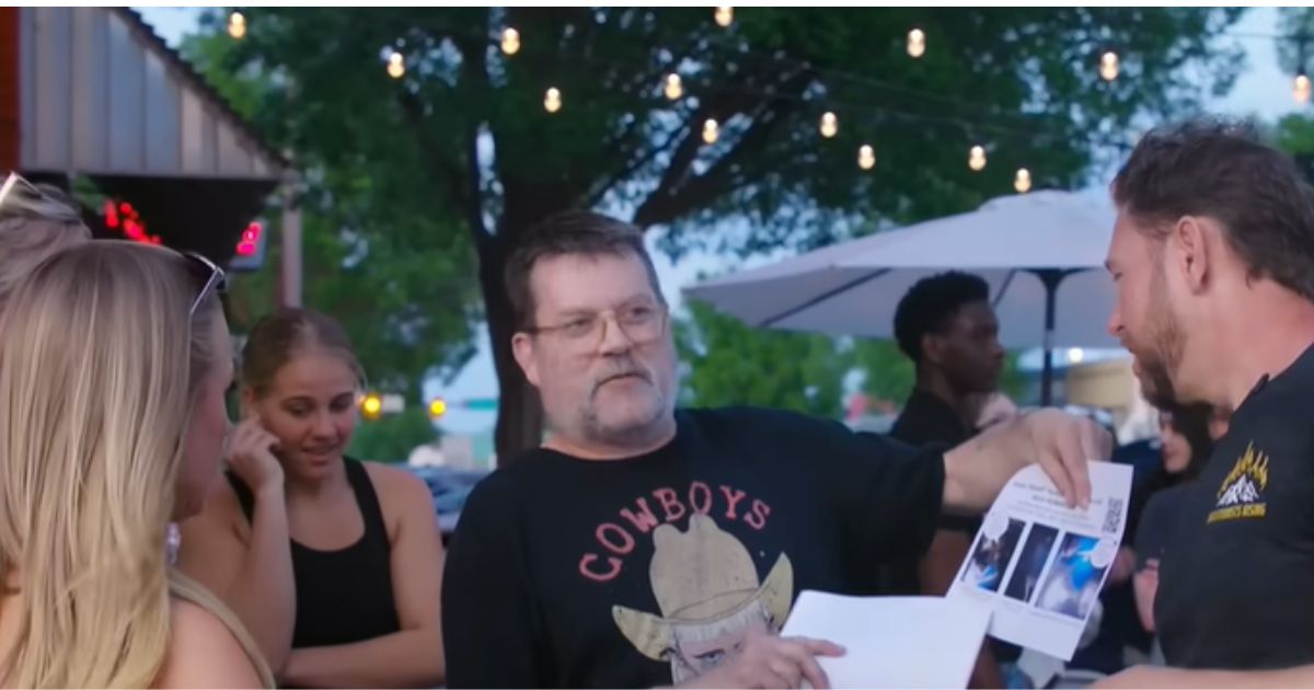 Abortion abolitionist activist T. Russell Hunter engages with a young woman and a college professor in Norman, Oklahoma, as shown in a June 5 video from Abolitionists Rising.