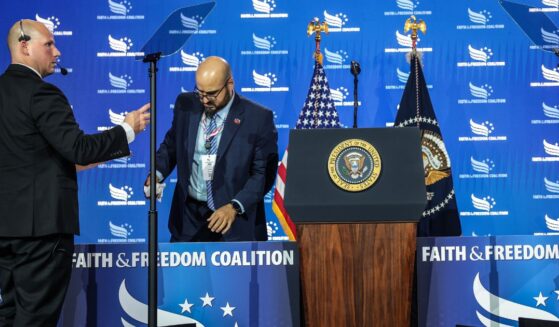 White House teleprompter operators, including Gabriel Perez, set up a teleprompter before President Donald Trump speaks at the Faith & Freedom Coalition's 2026 Policy Conference at the Washington Hilton on June 26, 2026, in Washington, D.C.