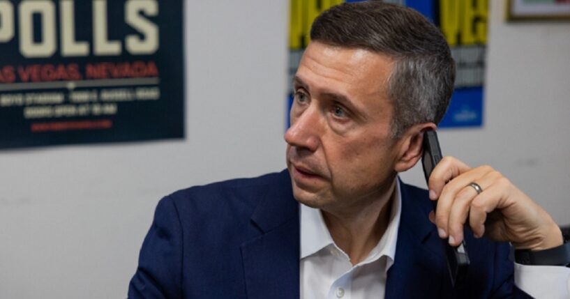 Democratic National Committee Chairman Ken Martin holds a cell phone in an October file photo in Los Angeles.