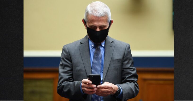 Director of the National Institute for Allergy and Infectious Diseases Dr. Anthony Fauci is pictured using his cell phone on June 23, 2020, before testifying before a U.S. Senate Health, Education, Labor, and Pensions Committee hearing.