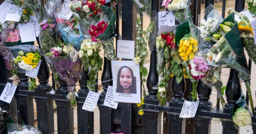 Flowers and cards placed by students and staff outside The Senate House on Aug. 17, 2026, in Cambridge, England.