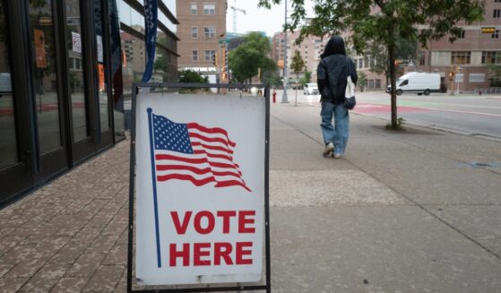 A sign marks the location of a polling place as residents vote in the state's primary election on Aug. 11, 2026, in Madison, Wisconsin.