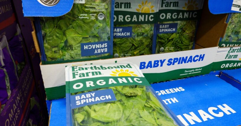 Packages of Earthbound Farm organic baby spinach are displayed for sale in the refrigerated produce department at a Costco Wholesale warehouse on July 29, 2026, in Arlington, Virginia.