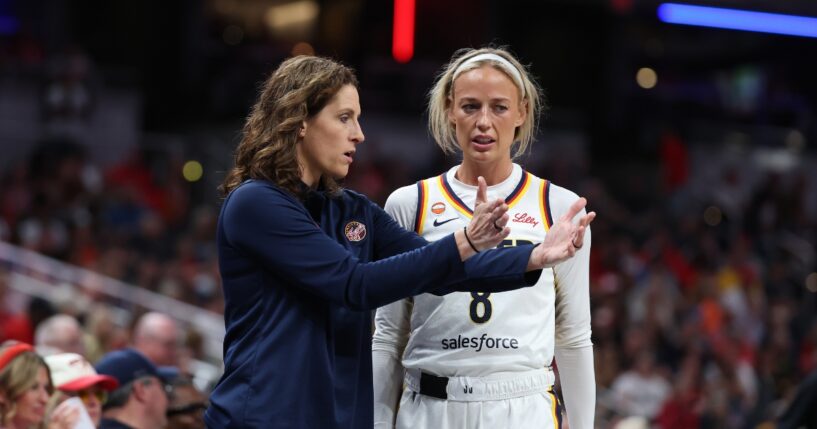 Sophie Cunningham of the Indiana Fever talks with head coach Stephanie White during the game against the Phoenix Mercury at Gainbridge Fieldhouse on June 24, 2026, in Indianapolis, Indiana.