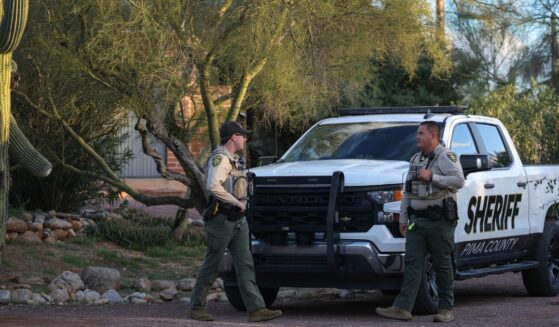 Pima County Sheriff's deputies are seen in front of Nancy Guthrie's residence during a shift change on Feb. 19, 2026, in Tucson, Arizona.