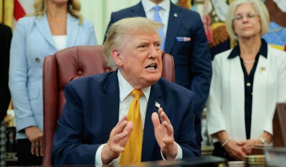 President Donald Trump speaks to the media after signing an executive order establishing the President's Military Spouse Commission in the Oval Office at the White House on Aug. 3, 2026, in Washington, D.C.
