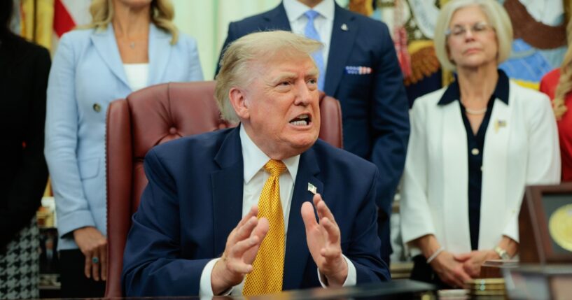 President Donald Trump speaks to the media after signing an executive order establishing the President's Military Spouse Commission in the Oval Office at the White House on Aug. 3, 2026, in Washington, D.C.
