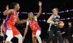 Sabrina Ionescu of the New York Liberty handles the ball against Alyssa Thomas and Monique Akoa Makani of the Phoenix Mercury during the first half of the WNBA game at Mortgage Matchup Center on Aug. 1, 2026, in Phoenix, Arizona.