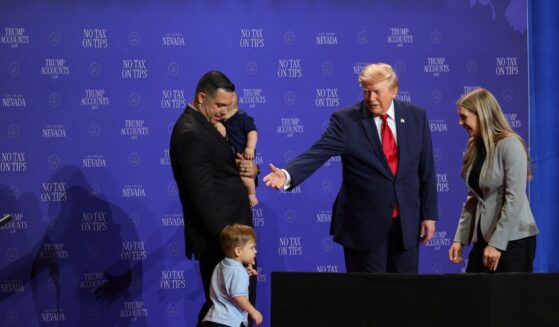 President Donald Trump introduces a family who has benefitted from the "no tax on tips" policy onstage during an event at Red Rock Casino Resort and Spa on Aug. 5, 2026, in Las Vegas, Nevada.