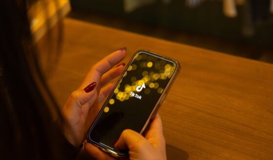 TikTok is displayed on a smartphone screen in this illustration photo in Corsica, France, on March 12, 2026.