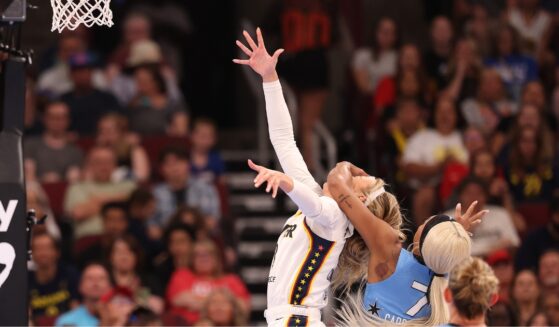 Sophie Cunningham of the Indiana Fever is fouled by DiJonai Carrington of the Chicago Sky during the first half at United Center on Aug. 8, 2026, in Chicago, Illinois.