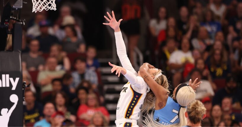 Sophie Cunningham of the Indiana Fever is fouled by DiJonai Carrington of the Chicago Sky during the first half at United Center on Aug. 8, 2026, in Chicago, Illinois.