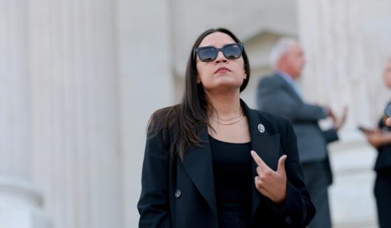 Rep. Alexandria Ocasio-Cortez speaks to reporters on the House steps after a series of votes at the U.S. Capitol on July 22, 2026, in Washington, D.C.