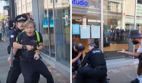 A man in Manchester, United Kingdom, is detained after purchasing a baseball bat, according to British activist Tommy Robinson on Aug. 9, 2026.