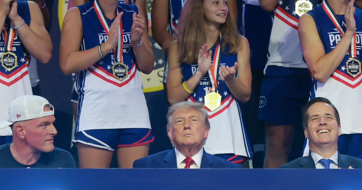 President Donald Trump sits next to sports analyst Pat McAfee as he attends the 2026 Patriot Games at SPIRE Academy on Aug. 11, 2026, in Geneva, Ohio.